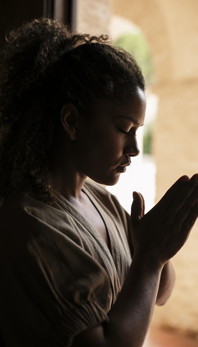 medium-shot-young-woman-praying